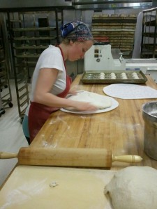 Caroline Clunk rolls out dough for vegan buns 