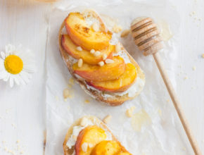 bruschetta with ricotta, grilled peach and honey, top view